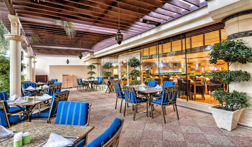 Shaded outdoor terrace of the resort's international restaurant